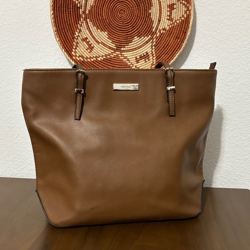 Nine West brown purse with zip closure, middle zip pocket, 3 sections.